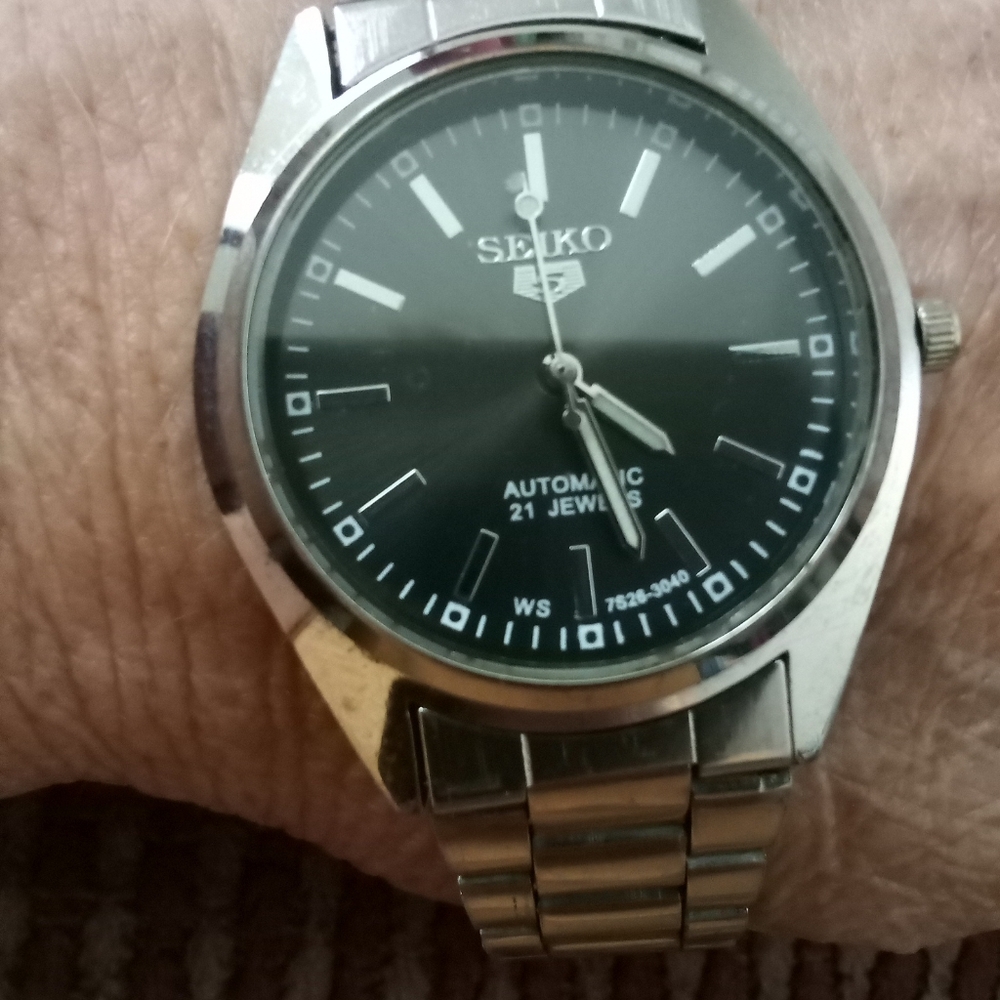 Seiko Silver and Black Stainless Steel Watch without date display.